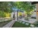 Relaxing backyard patio with pergola, seating area, and built-in grill at 6701 N Scottsdale Rd # 24, Scottsdale, AZ 85250
