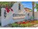 Elegant community entrance with ornate lettering and landscaping at 6701 N Scottsdale Rd # 24, Scottsdale, AZ 85250