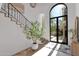 Bright and spacious entryway with a grand staircase and large windows at 6701 N Scottsdale Rd # 24, Scottsdale, AZ 85250