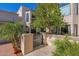 Inviting exterior with lush landscaping and a metal gate at 6701 N Scottsdale Rd # 24, Scottsdale, AZ 85250