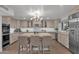 Modern kitchen with light cabinets, large island, and stainless steel appliances at 6701 N Scottsdale Rd # 24, Scottsdale, AZ 85250