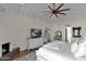 Main bedroom with vaulted ceilings, fireplace and private balcony access at 6701 N Scottsdale Rd # 24, Scottsdale, AZ 85250
