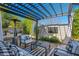 Outdoor entertaining area with pergola, grill, and comfortable seating at 6701 N Scottsdale Rd # 24, Scottsdale, AZ 85250