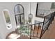 Elegant staircase with wrought iron railing and arched windows at 6701 N Scottsdale Rd # 24, Scottsdale, AZ 85250