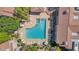 Community pool and spa with surrounding lounge chairs at 15050 N Thompson Peak Pkwy # 2006, Scottsdale, AZ 85260
