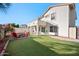 Landscaped backyard with firepit and patio at 1705 E Windsong Dr, Phoenix, AZ 85048