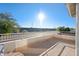 Private balcony overlooking a road and distant mountains at 1705 E Windsong Dr, Phoenix, AZ 85048