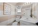 Clean bathroom with white vanity and striped wall accents at 1705 E Windsong Dr, Phoenix, AZ 85048