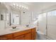 Bathroom with double sinks and a shower/tub combo at 1705 E Windsong Dr, Phoenix, AZ 85048