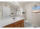 Clean bathroom with single vanity, shower, and toilet at 1705 E Windsong Dr, Phoenix, AZ 85048