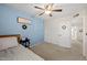 Bedroom with twin bed, ceiling fan, and spacious closet at 1705 E Windsong Dr, Phoenix, AZ 85048
