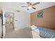 Small bedroom with twin bed, ceiling fan and closet at 1705 E Windsong Dr, Phoenix, AZ 85048