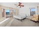 Bright bedroom with a queen-size bed and private balcony access at 1705 E Windsong Dr, Phoenix, AZ 85048