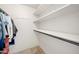 Walk-in closet with hanging rods and shelves for storage at 1705 E Windsong Dr, Phoenix, AZ 85048