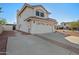 Two-story house with a two-car garage and side yard access at 1705 E Windsong Dr, Phoenix, AZ 85048