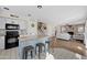 Open kitchen with island, stainless steel appliances, and view of living room at 1705 E Windsong Dr, Phoenix, AZ 85048