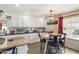 Charming kitchen with white cabinets and a farmhouse-style table at 2600 E Allred Ave # R87, Mesa, AZ 85204