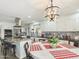 Elegant kitchen with granite island and stylish light fixture at 2600 E Allred Ave # R87, Mesa, AZ 85204