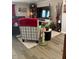 Bright living room features a large TV, comfy seating, and updated flooring at 2600 E Allred Ave # R87, Mesa, AZ 85204
