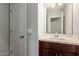 Bathroom with single vanity, dark brown cabinets and a white countertop at 2821 S Skyline Dr # 123, Mesa, AZ 85212