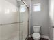 Bathroom with shower stall and toilet, featuring neutral-toned walls at 2821 S Skyline Dr # 123, Mesa, AZ 85212