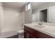 Bathroom with bathtub, toilet and dark brown vanity at 2821 S Skyline Dr # 123, Mesa, AZ 85212