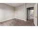 Spacious bedroom featuring carpet flooring and an ensuite bathroom at 2821 S Skyline Dr # 123, Mesa, AZ 85212