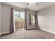 Bedroom with sliding glass door to balcony, carpet, and neutral walls at 2821 S Skyline Dr # 123, Mesa, AZ 85212
