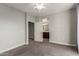 Bright bedroom with carpet flooring and access to a private bathroom at 2821 S Skyline Dr # 123, Mesa, AZ 85212