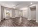 Spacious living room with hardwood floors and neutral walls at 2821 S Skyline Dr # 123, Mesa, AZ 85212