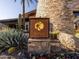 Kiva Club sign with desert landscaping including cactus, agave, and inlaid rock at 28831 N 128Th Dr, Peoria, AZ 85383