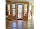 Elegant entryway with wood-look floors and stylish front door at 28831 N 128Th Dr, Peoria, AZ 85383