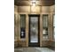 Inviting front entrance featuring a decorative glass door and sidelight windows at 28831 N 128Th Dr, Peoria, AZ 85383