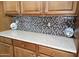 Modern kitchen features granite countertops and wood cabinets at 28831 N 128Th Dr, Peoria, AZ 85383
