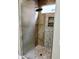 Spa-like shower with pebble tile and glass enclosure at 28831 N 128Th Dr, Peoria, AZ 85383