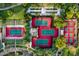 Aerial view of community tennis and pickleball courts surrounded by lush landscaping at 28831 N 128Th Dr, Peoria, AZ 85383