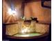 Custom-lit tiled water feature provides tranquil views during the evening at 28831 N 128Th Dr, Peoria, AZ 85383