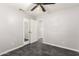 Bedroom with mirrored closet doors and ceiling fan at 3150 W Foothill Dr, Phoenix, AZ 85027