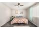 Bright bedroom featuring a large bed and ceiling fan at 3150 W Foothill Dr, Phoenix, AZ 85027