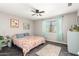 Spacious bedroom with ceiling fan and en-suite bathroom at 3150 W Foothill Dr, Phoenix, AZ 85027