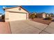 Tan house with a beige garage door and small front yard at 3150 W Foothill Dr, Phoenix, AZ 85027