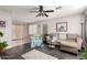 Living room with light taupe couch and teal armchair at 3150 W Foothill Dr, Phoenix, AZ 85027