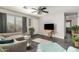 Living room with taupe couch, a TV, and a drop leaf table at 3150 W Foothill Dr, Phoenix, AZ 85027