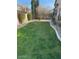 Well-maintained backyard features lush green grass and neatly trimmed landscaping at 4030 E Lexington Ave, Gilbert, AZ 85234