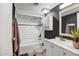 The bathroom features a white vanity, white subway tile, and dark accent wall at 4600 N 68Th St # 313, Scottsdale, AZ 85251