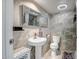 Bathroom featuring modern fixtures, a pedestal sink, and marble accents at 4600 N 68Th St # 313, Scottsdale, AZ 85251