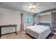 Comfortable bedroom with built-in shelving, modern lighting and a large window at 4600 N 68Th St # 313, Scottsdale, AZ 85251