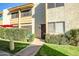 Exterior of a two-story building with a well-maintained lawn and inviting entrance at 4600 N 68Th St # 313, Scottsdale, AZ 85251