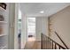 Hallway with neutral walls, carpet, and decorative wood accent at 4600 N 68Th St # 313, Scottsdale, AZ 85251