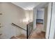 Upstairs hallway with neutral walls, carpet, and modern light fixture at 4600 N 68Th St # 313, Scottsdale, AZ 85251